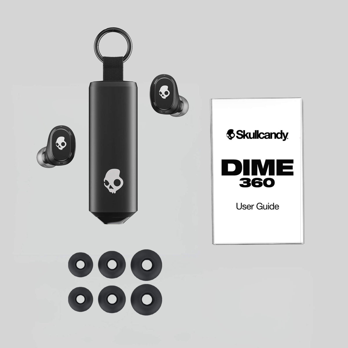 Skullcandy Dime 360 earbuds with case and user guide on a gray background | Skullcandy X Peanuts Snoopy
